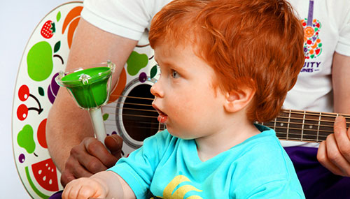 a child playing drums at Fruity Tunes
